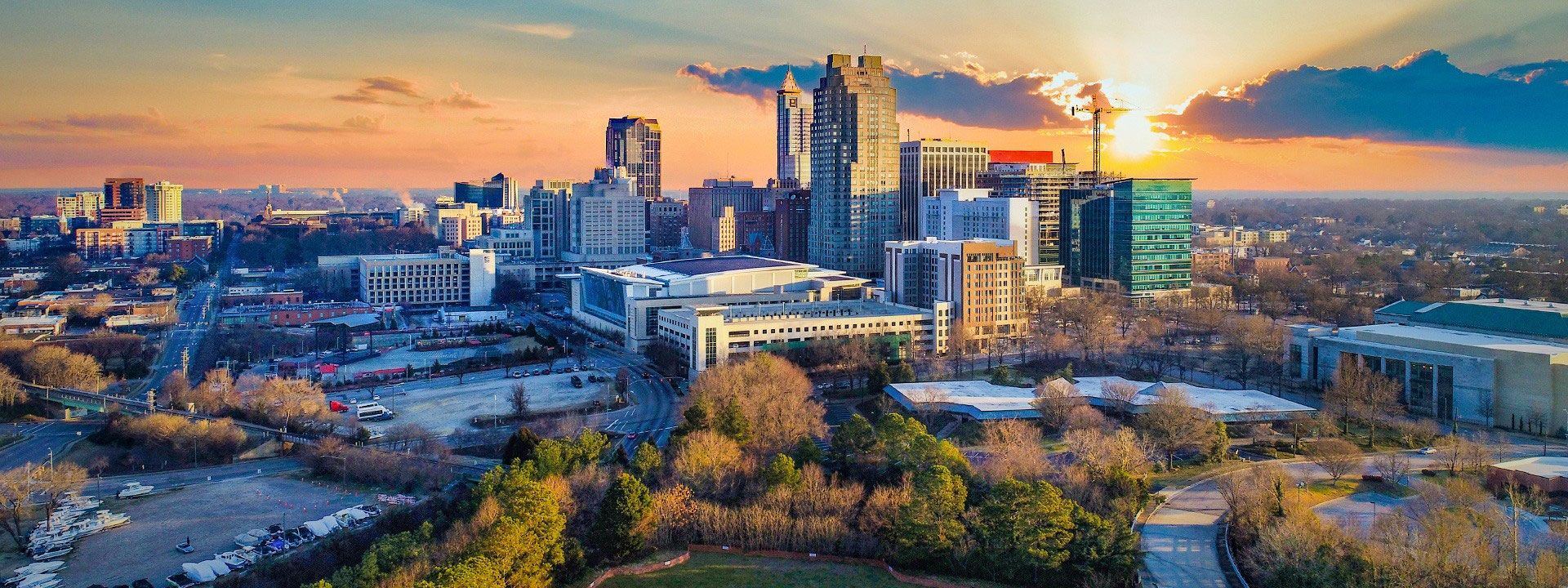 North Carolina city skyline at sunset — service area for My Guaranteed Home Offer